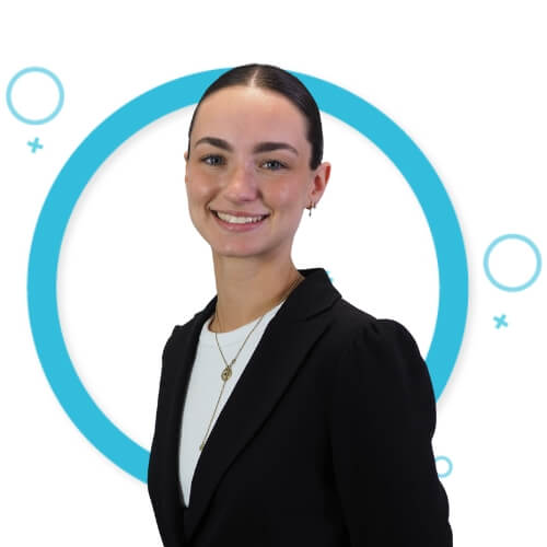 Professional headshot of Rebecca Villegas, Administrator at M Physio, smiling in front of a white background with blue circular graphics, wearing a black blazer and white top.