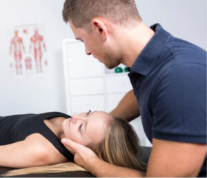 Physiotherapist performing vestibular treatment for dizziness in clinic setting
