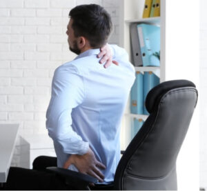 Man sitting at a desk with neck and lower back pain — a sign of poor core strength and back pain