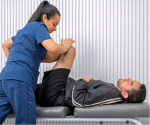 Physiotherapist treating sacroiliac joint pain with hands-on therapy.