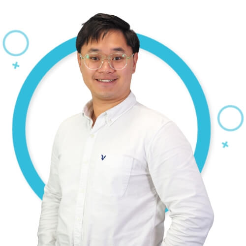 Portrait of Austin Chua in from of blue circle background