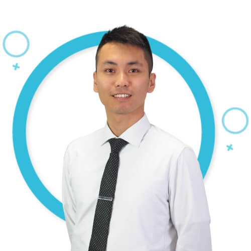 Portrait of Marco Lin in front of blue circles background.