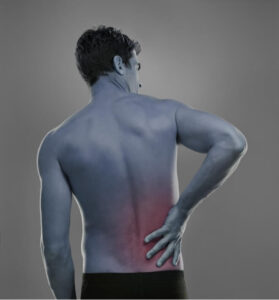 Man holding his lower back, with the painful area highlighted in red after experiencing lifting-related back pain.
